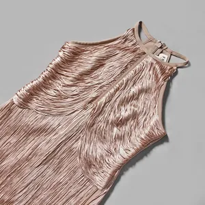 Detailed close-up of champagne fringe bandage dress featuring elegant shimmering tassels.