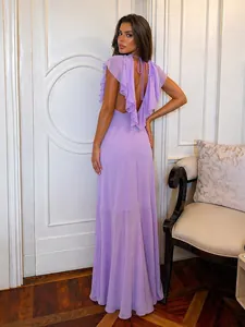 Detailed back view of an elegant purple ruffle backless evening gown with tie closure