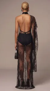 Rear view detail of an elegant black floral lace sheer halter dress with sexy open back