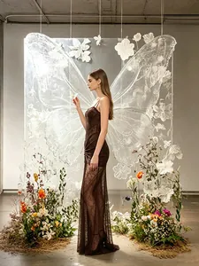 Elegant brown lace evening dress with hollow detailing in an artistic floral setting