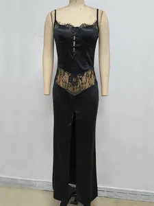 Detail of black satin camisole dress with elegant lace patchwork and high slit design
