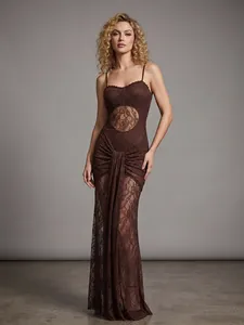Full length studio shot of brown lace evening gown with cutout details and ruffles