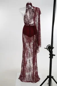 Detailed back view of a sexy burgundy lace maxi dress with halter neck and open back