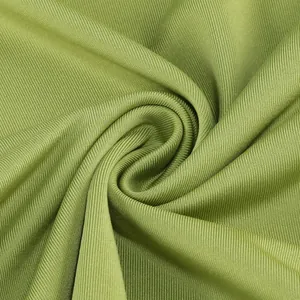 Primer plano de la textura de la tela de punto acanalado verde aguacate de calidad