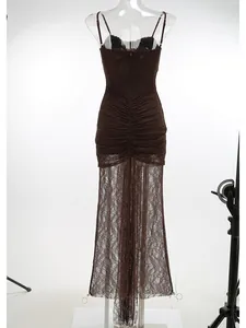 Detailed view of brown lace ruched evening dress with sheer maxi skirt and straps