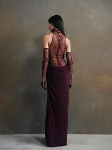 Back view of an elegant burgundy lace halter gown with matching gloves for evening wear.