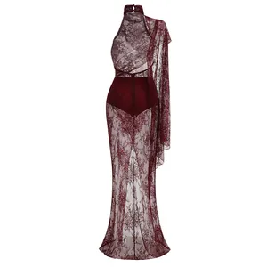 Detailed view of the wine red lace maxi dress with halter neck and sheer floral lace skirt