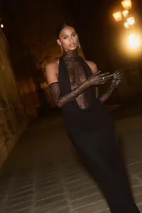 Detailed view of sexy black halter dress with lace patchwork and matching gloves