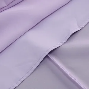 Detailed close-up of lavender chiffon fabric showing professional stitching and texture