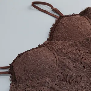 Detailed view of brown floral lace dress bodice featuring delicate thin straps and cups.