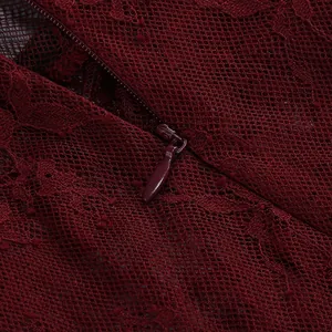Close-up view of elegant burgundy lace fabric and high-quality invisible zipper