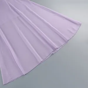 Close-up detail of the lavender fabric and hemline on a flowy high-waisted evening dress