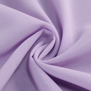 Close-up detail of soft purple chiffon fabric with fine texture and elegant drape