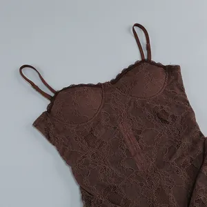 Macro detail showing the intricate brown floral lace texture and camisole bodice.