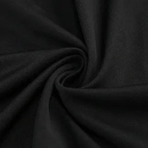 Macro view of the high-quality black ribbed fabric texture of the evening dress