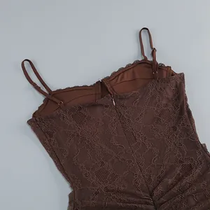 Detailed view of a brown floral lace bodice featuring thin spaghetti straps and a zipper