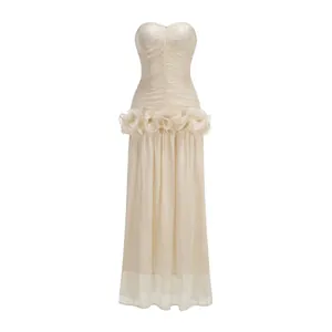 Elegant strapless champagne evening gown featuring a ruched bodice and ruffled waist detail