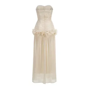 Back view of a champagne French style strapless evening gown with elegant ruffled waist detail.
