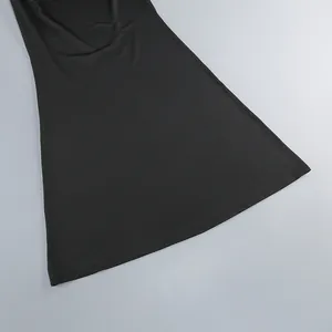 Close-up detail showing the smooth hemline and fabric texture of the black evening gown
