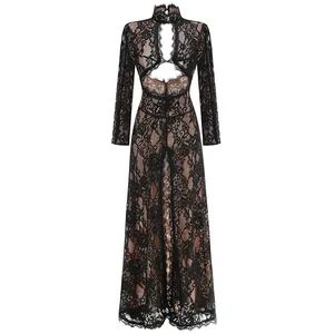Detail view of black floral lace fabric on a long sleeve maxi dress with chest cutout