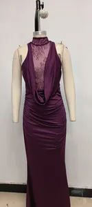 Detail view of purple halter dress with lace patchwork and elegant ruched texture