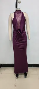 Elegant halter neck evening dress with lace patchwork and ruched detail in plum purple.