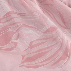 Close-up view of a pink summer dress fabric with elegant white leaf print and linen texture