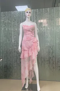 Pink floral printed camisole dress with ruffled asymmetrical hem and slit detail.