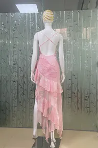 Detail of pink floral backless dress with ruffled asymmetrical hem and cross straps