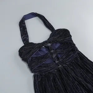Close-up detail of a dark blue pleated halter neck evening dress with metal rings