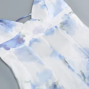 Detailed close-up of a French style floral camisole dress with blue flower prints