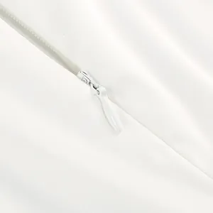 Macro view showing the high-quality white invisible zipper detail on formal evening gown