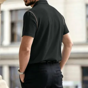 Detailed back view of a black waffle-knit men's polo shirt with brown piping accents