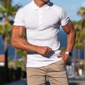 Close-up view of a white ribbed slim fit short sleeve polo shirt on an athletic male model