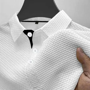 Macro detail of white textured ice silk polo shirt showing waffle weave pattern.