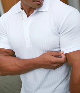 Close-up of white ribbed short sleeve polo shirt for men featuring texture details