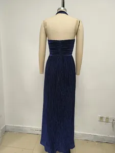 Detailed back view of a luxury navy blue pleated halter neck evening gown with elegant texture