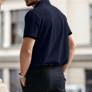 Back view of a navy blue waffle knit polo shirt for men showing high-quality texture