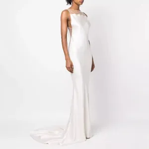 Elegant white satin backless evening gown with sheer mesh details and fishbone slim fit.
