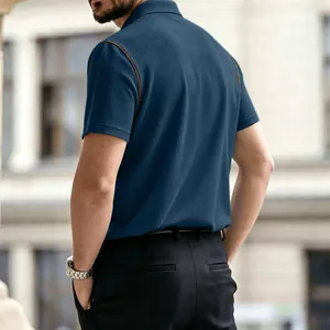 Back view detail of breathable blue waffle texture men's polo shirt with brown piping