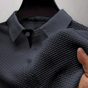 Close-up of black men's polo shirt featuring breathable ice silk waffle texture