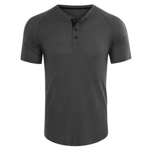 Detailed close-up view of a men's waffle knit Henley shirt in a charcoal grey color