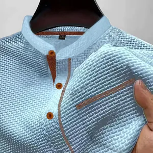 Close-up of breathable ice silk fabric on light blue men's Henley shirt