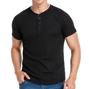 Men's slim fit black short sleeve Henley shirt with textured waffle knit fabric.