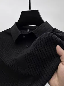 Close-up of black ice silk polo shirt with honeycomb texture and quick-dry fabric.