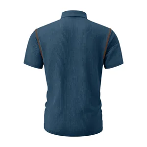 Detailed back view of a men's blue waffle knit short sleeve polo shirt with brown stitching