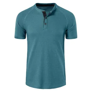 Macro view showing the teal waffle knit texture and three-button placket detail