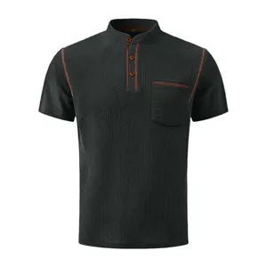 Detailed macro view of breathable men's grey Henley shirt with orange contrast stitching.