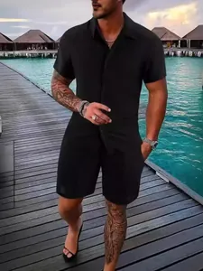 Men's black short sleeve casual shirt and shorts beach set on a tropical wooden pier