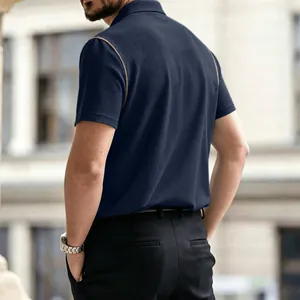 Close-up back view of men's navy blue polo shirt featuring waffle texture and brown trim